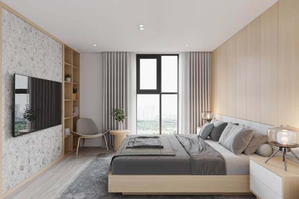 istock A sleek and bright bedroom, and a city view from a large window. 2157389974