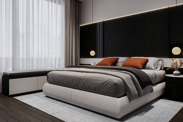 istock Stylish bedroom interior with large comfortable bed and bench. 2157390313