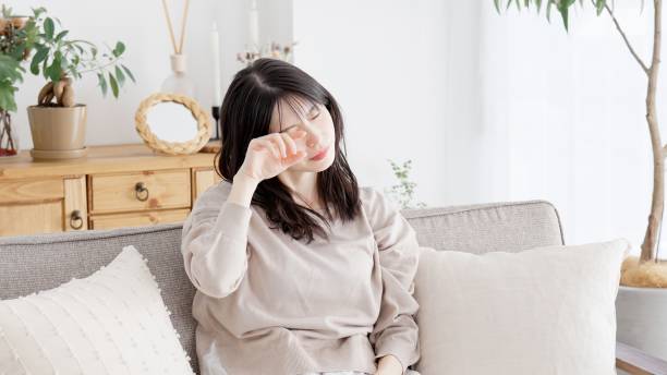 istock A woman rubbing her sleepy eyes 2157391210