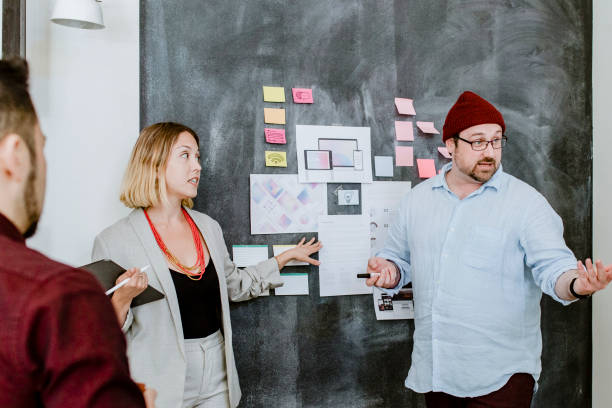 istock Startup team brainstorming in meeting room using blackboard 2157392604