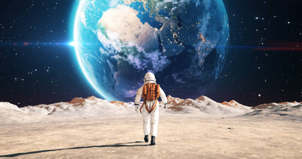 istock Astronaut On An Alien Planet Walking To His Base Camp. Earth Is Visible. 2157392789
