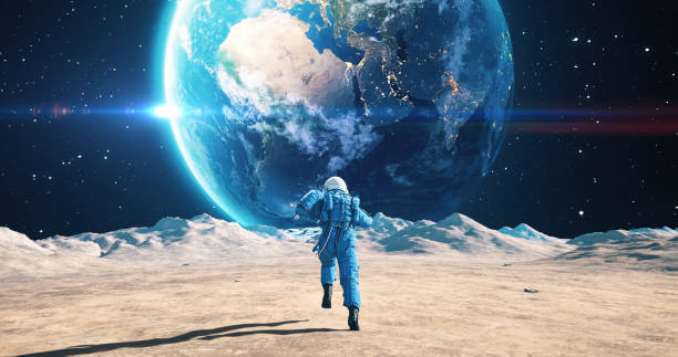 istock Male Astronaut Running On The Moon. Blue Planet Earth Visible. 2157392904