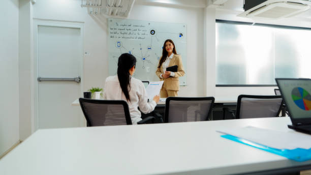 istock Confidence Project manager Businesswoman Presenting at Office Meeting 2157394077