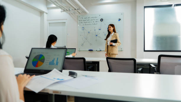 istock Businesswoman Delivering Presentation in Office 2157394084