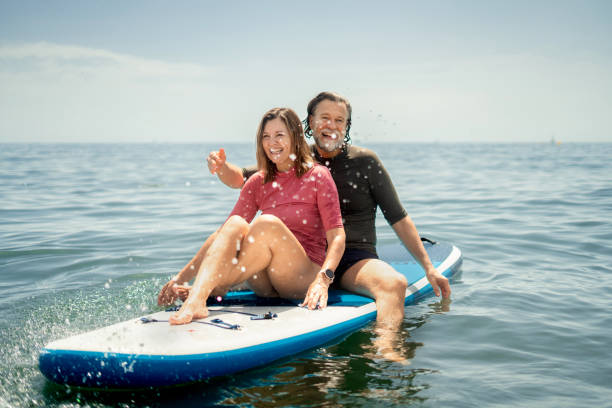 istock Mature couple Enjoying Paddleboarding 2157394354