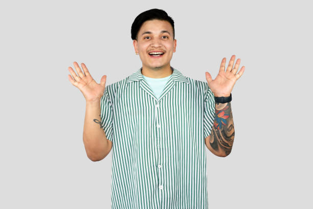 istock Asian Young Student Entrepreneur Giving Expressions and Making Gestures with Happy face Pointing 2157394524