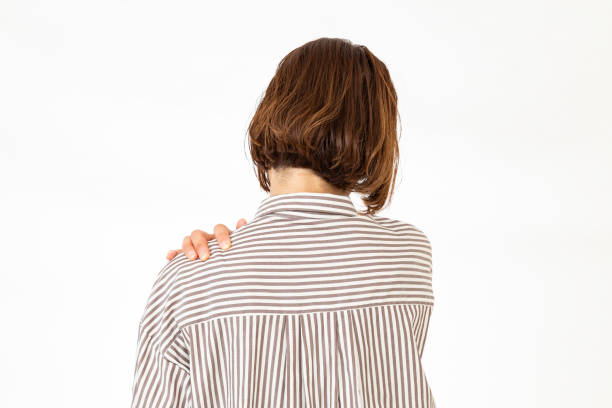istock A woman suffering from stiff shoulders. 2157394675