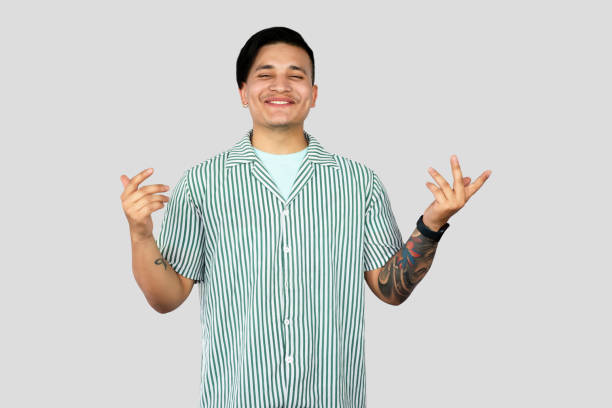 istock Asian Young Student Entrepreneur Giving Expressions and Making Gestures with Happy face Pointing 2157394845