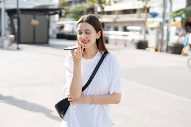 istock Female caucasian tourist using language translation app on smartphone 2157394887