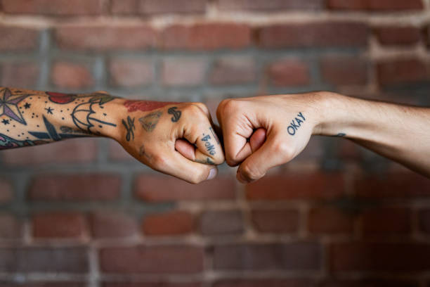 istock Friends giving each other a fist bump 2157395953