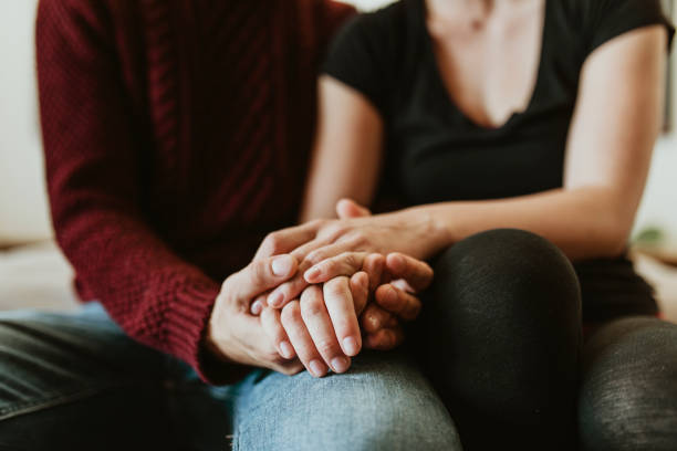 istock Passionate couple holding hands in bed 2157396059