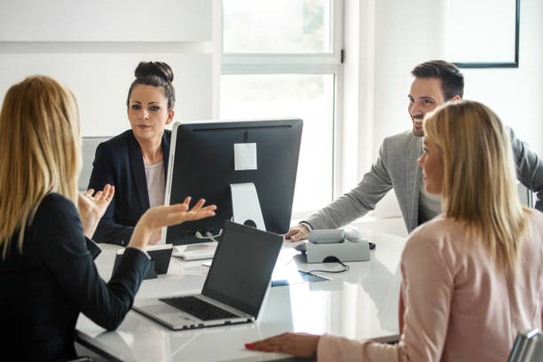 istock Brief business meeting at the office. 2157397499