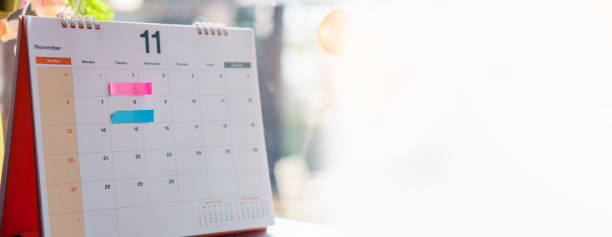 istock 2024 Calendar desk place on table. Desktop Calender for Planner to plan agenda, timetable, appointment, organization, management each date, month, and year on wooden office table. Calendar Concept-banner image. 2157398134