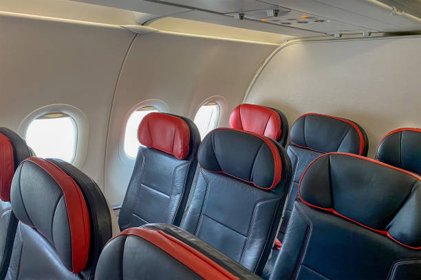 istock rows of seats in an empty airplane cabin 2157398602