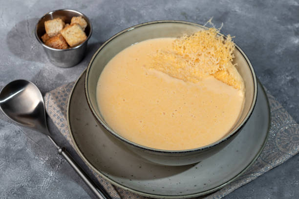 istock Cheese soup with croutons on a gray background. 2157399379