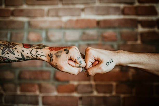 istock Friends giving each other a fist bump 2157399466