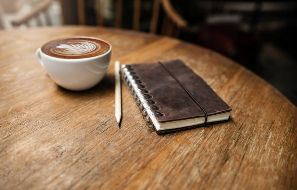 istock coffee drink and old on wooden desk 2157399482