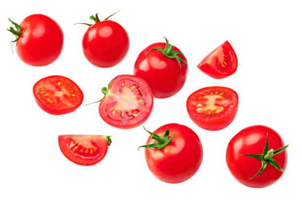 istock flying fresh tomatoes isolated on white background. clipping path 2157400833