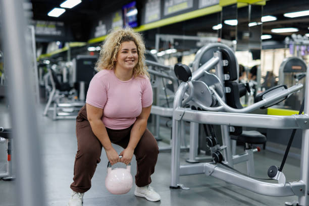 istock Plus Size Woman Working Out in Gym 2157402016