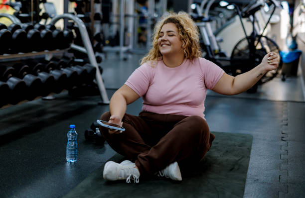 istock Positive Woman Enjoying Break at Gym 2157402041