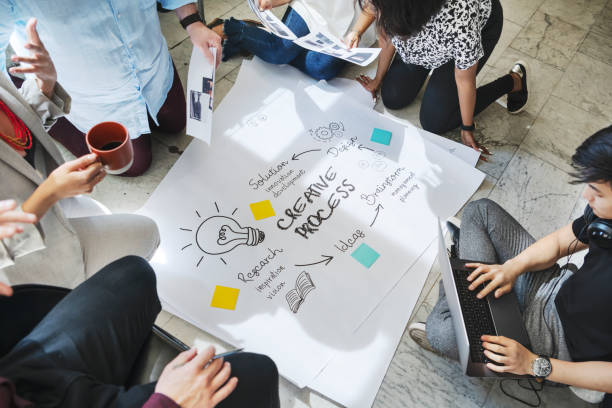 istock Business people brainstorming management process on paper 2157402386