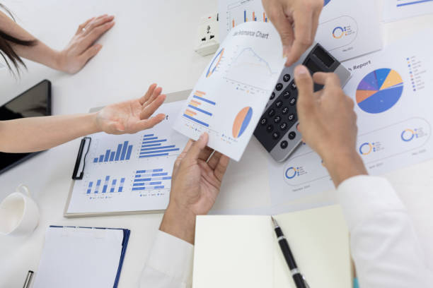 istock Hands of business team working with business data analytics on table at office. 2157403254