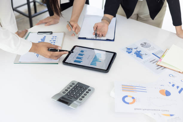 istock Hands of business team working with business data analytics on table at office. 2157403317