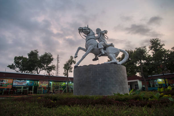 Semarang, Central Java, Indonesia - 01/03/2024: \nIndonesian proclaimer Sukarno statue located at Tawang train station in Semarang, Indonesia.\nIn 1970, ten years before Sukarno's statue stood on the proclaimer's monument, an admirer of Sukarno, Dukut Hendronoto, had a statue of Sukarno made in his house. Dukut, who is usually called Pak Ooq, is known as an artist and pioneer of animation in Indonesia.