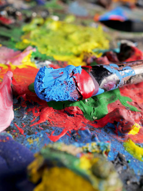 istock acrylic painted palette background with brush 2157404112