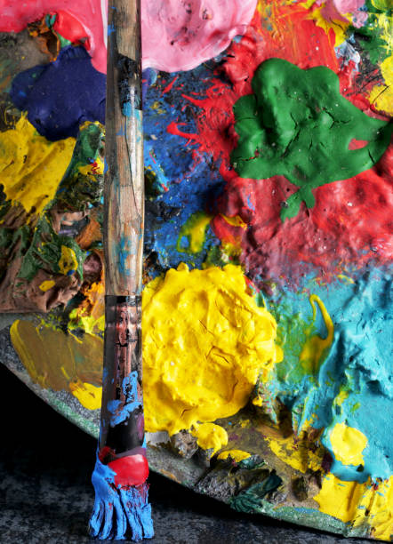 istock acrylic painted palette background with brush 2157404116