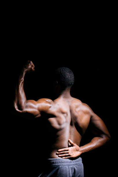 istock Rear view of muscular black man 2157407581
