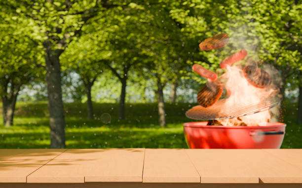 istock Close-up of a table with a barbecue in the background at a park 2157407721