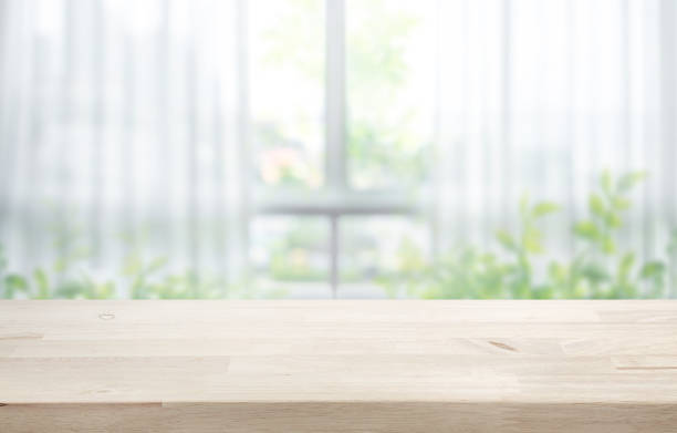istock Selective focus.Wood table counter on blur curtain window in fresh morning background.copy space 2157409458