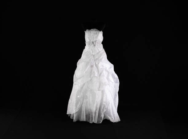 istock white wedding dress isolated on black background 2157410723