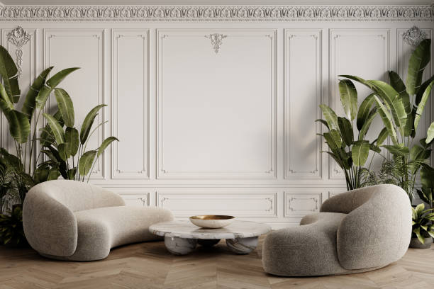 istock Classic white interior with two sofas, marble coffee table, plants, wooden chevron flooring and moldings. 3d render illustration mockup. 2157415431