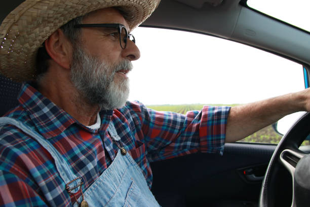 istock Farmer in car drive 2157416023
