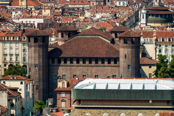 Turin, TO, Italy - June 3, 2025: Ancient Building called CASTELLO that means CASTLE with two towers and statue of Kings of Italy and Soldiers