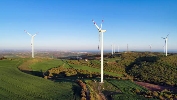 istock Wind Turbines on Green Hills 2157416124