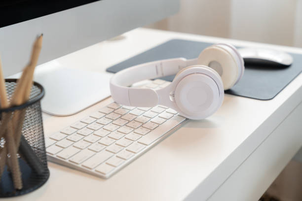 istock Office table desk, Personal computer, Headphone and pencil on the table. 2157417359