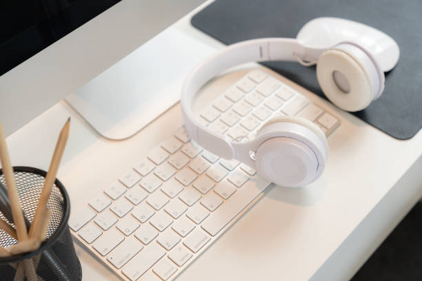 istock Office table desk, Personal computer, Headphone and pencil on the table. 2157417363