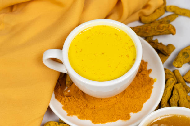 istock A traditional Ayurvedic drink with milk and turmeric in a white cup 2157417678