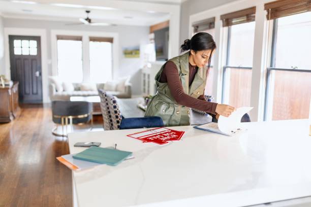 Real estate agent checking a real estate list before clients coming