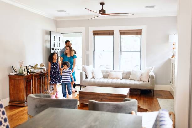istock Clients entering a house with a real estate agent and looking around 2157419975