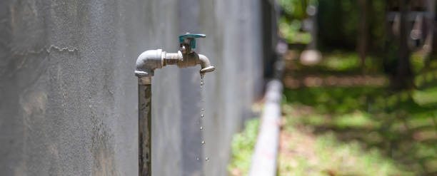 istock Old faucet outside the house dripping 2157420339