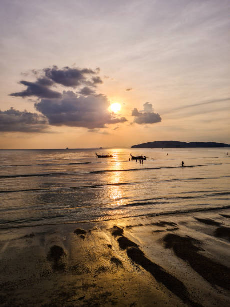 Beautiful sunset on the Ao Nang beach on the Andaman sea in Thailand.