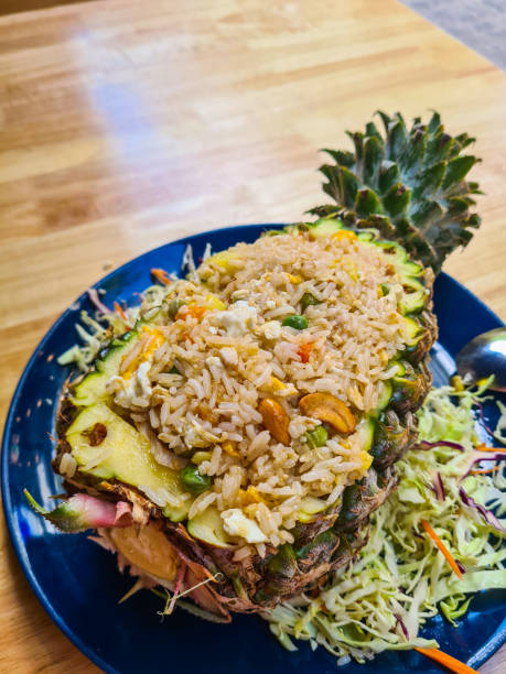 Thai pineapple fried rice with chicken on the table in the restaurant in Thailand.