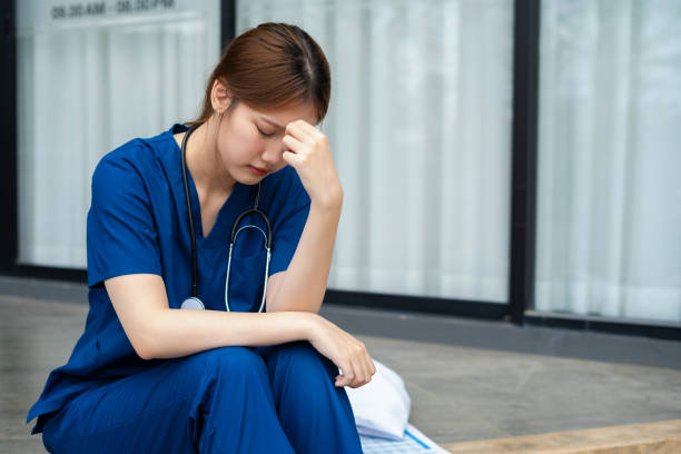 istock Stressed doctor sitting in front of office, working pressure. 2157425920