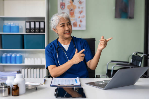 istock Happy female doctor presenting or pointing, happy working. 2157426398