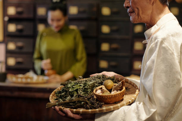 istock Healer Preparing Dried Herbs For Medicine Recipe 2157426438