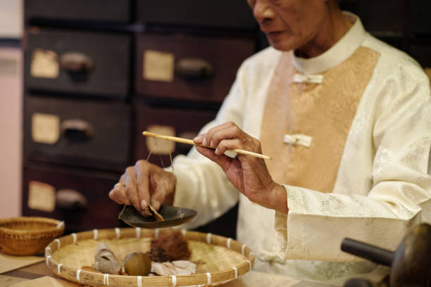 istock Apothecary Measuring Ingredients With Old Scale 2157426701